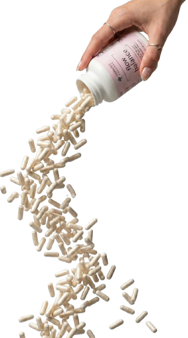 Hand pouring Flow Balance capsules from the bottle