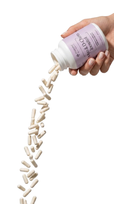 Hand pouring Myo & D-Chiro Inositol capsules from the bottle